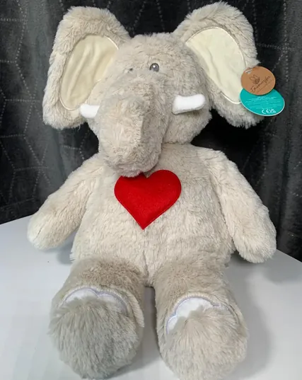 Eddie, a grey elephant soft toy with a red heart on his chest