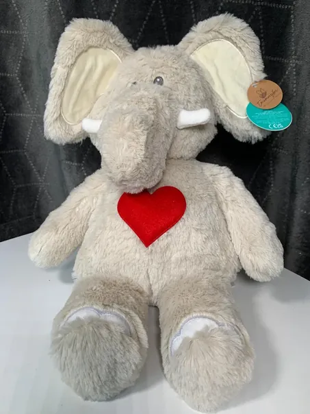 Eddie, a grey elephant soft toy with a red heart on his chest