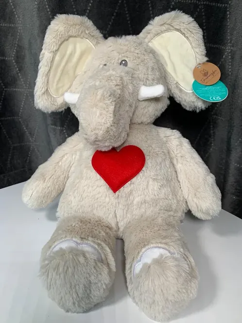Eddie, a grey elephant soft toy with a red heart on his chest